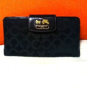 Black and pink Coach wallet.